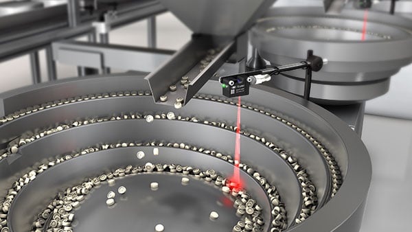 Filling level monitoring in the vibrating spiral feeder